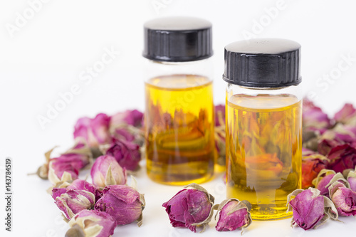 Rose essential oil, rose buds for body care.