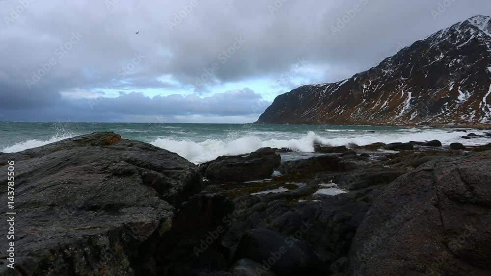 The tide on the rocky shore of the Lofoten Islands The tide on the rocky shore of the Lofoten Islands