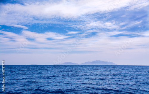 Seascape and beautiful blue sky with cirrus clouds