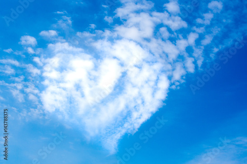 Heart shape clouds on a sunny day