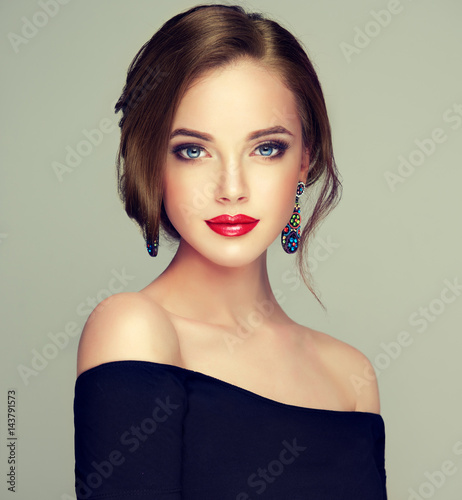 Beautiful model girl with elegant hairstyle . Woman with fashion style makeup