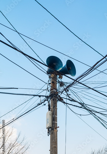 old loudspeaker with electric wires photo