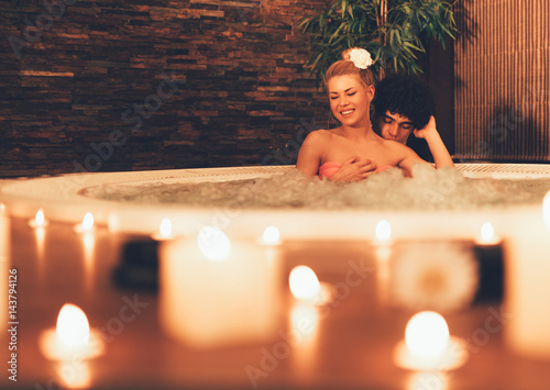 Couple Relaxing In Spa Center.
