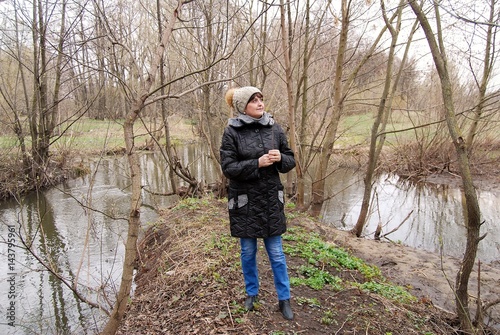 Woman in the spring near the river