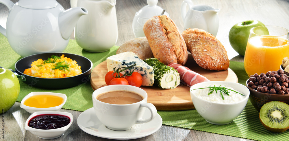 Breakfast served with coffee, cheese, cereals and scrambled eggs Breakfast served with coffee, cheese, cereals and scrambled eggs