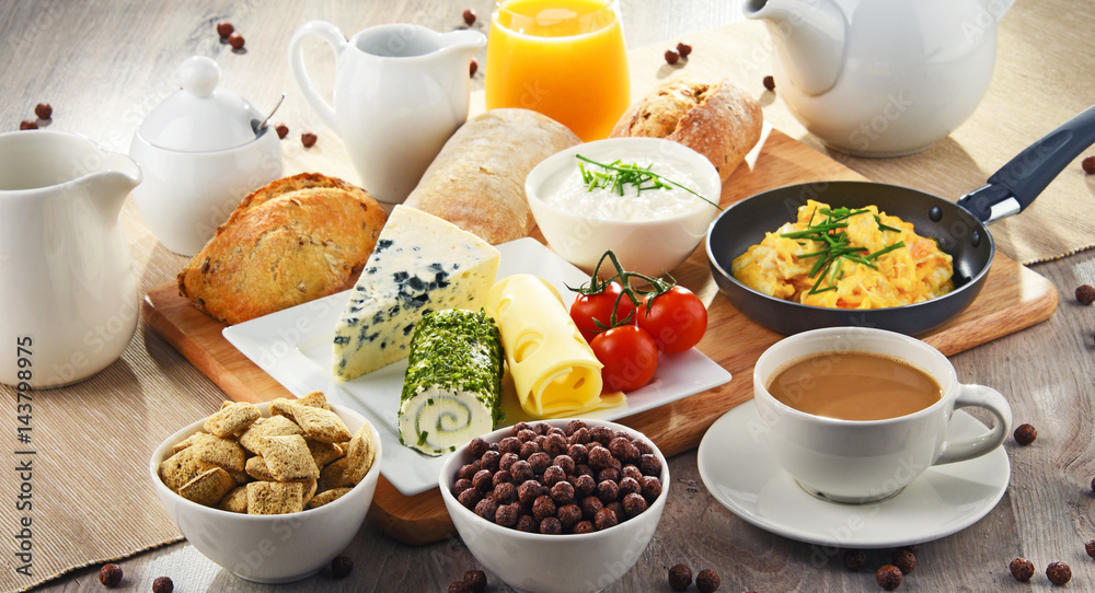 Breakfast served with coffee, cheese, cereals and scrambled eggs