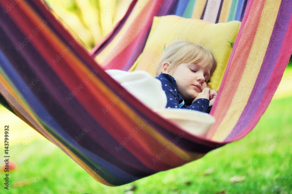 Child sleep in hammock.