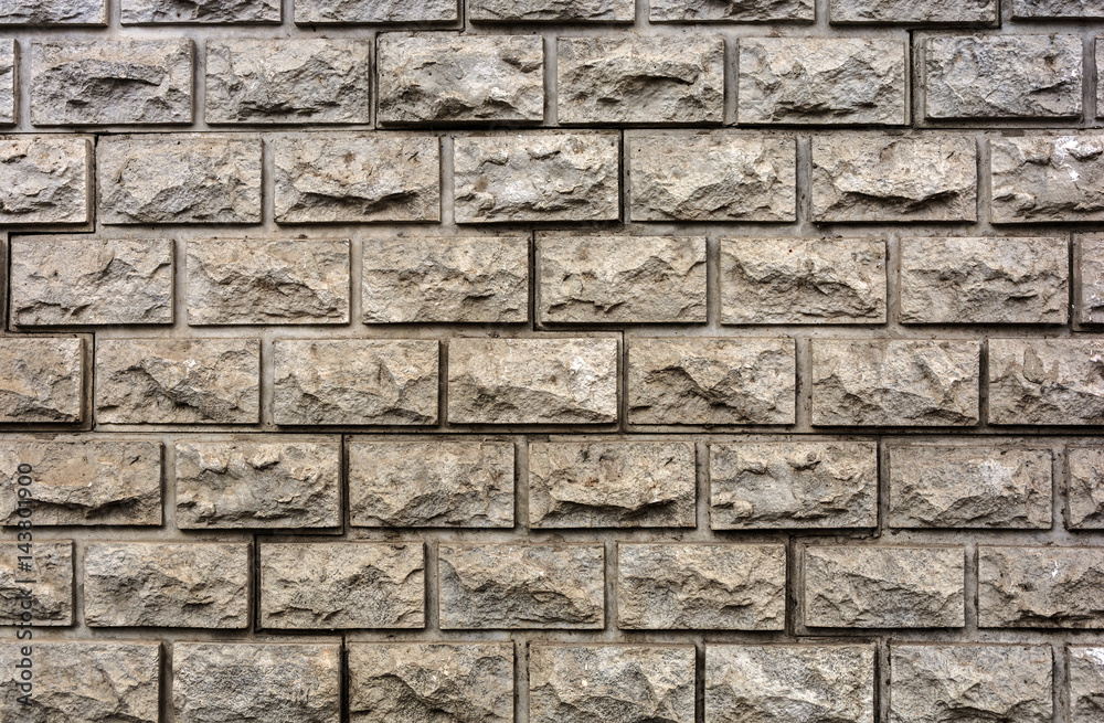 Facing a decorative brick pale yellow in color
