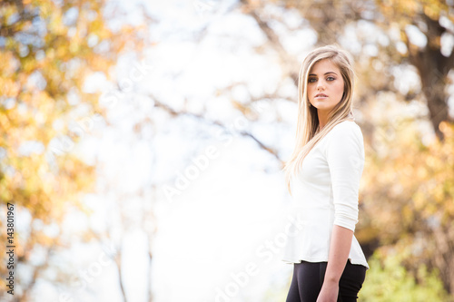 Beautiful teen model on a farm with an old house © Dewald