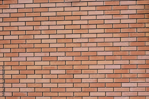 Background of red facing bricks.