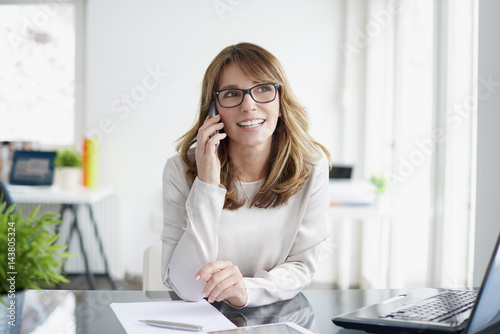 Confident professional businesswoman working on a new project at office