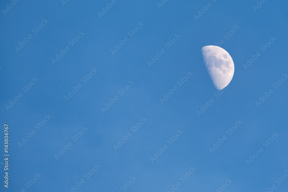 Half moon in the blue sky Half moon in the blue sky