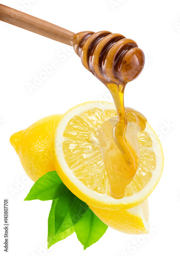 dripping honey on lemons isolated on a white background