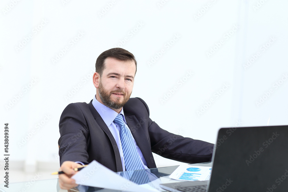Business man using laptop and modern devices in office Business man using laptop and modern devices in office
