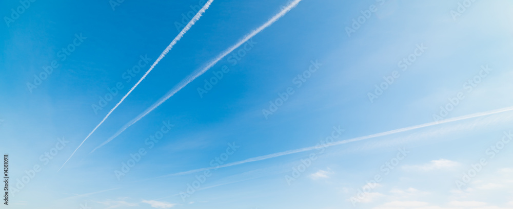 Blue sky with contrails - obrazy, fototapety, plakaty 