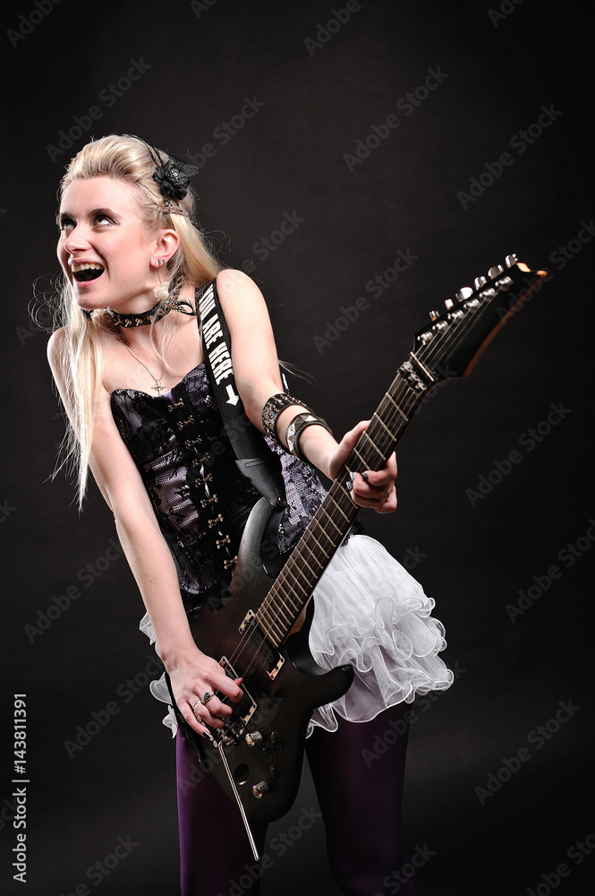 Fototapeta premium Beautiful blonde girl with electric guitar