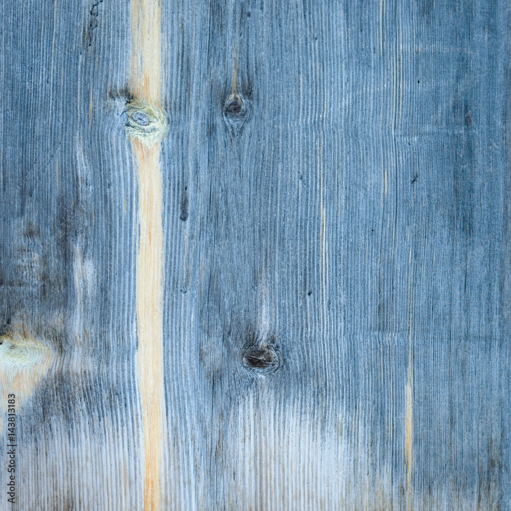 Old blue wooden wall, detailed background photo texture. Wood plank fence close up. Retro color style.