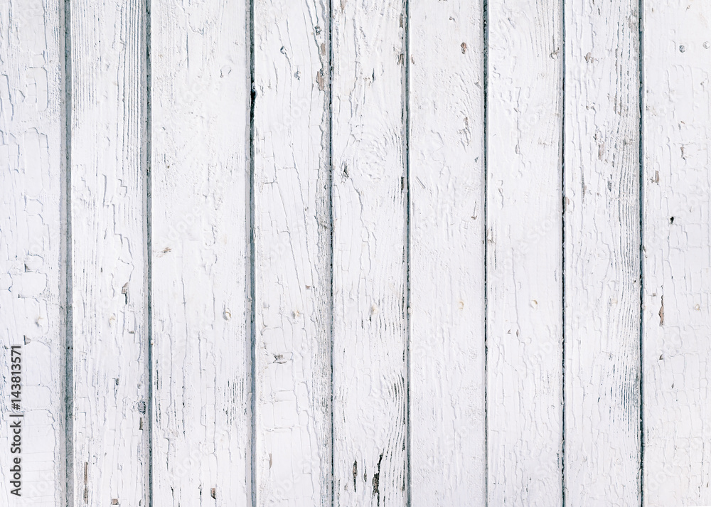 Wood plank fence with an old paint white color close up. Detailed background photo texture. Wooden wall abstract background.