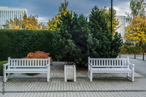 Two Empty White Benches