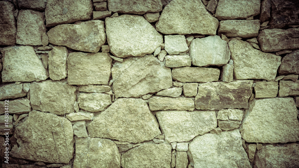 Stone wall texture background. Vintage filter.