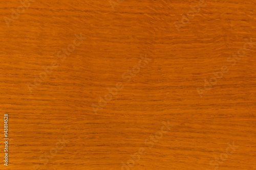The texture of wood, oak, varnished. Red, orange.