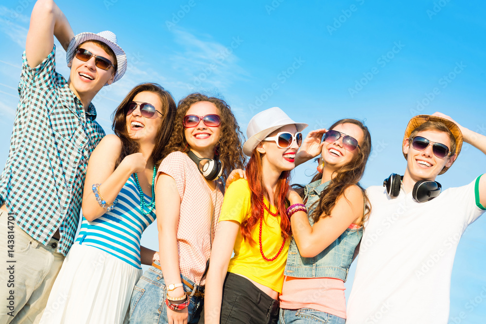 group of young people wearing sunglasses and hat group of young people wearing sunglasses and hat