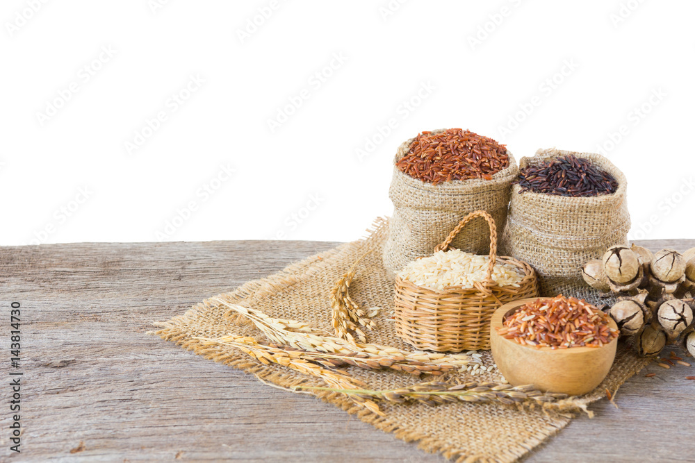 Asian group of grain rice,black rice,red rice ,rice riceberry in gunny bag on old wooden isolate on white background