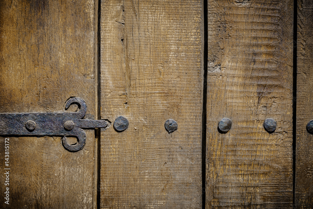 Detail of an old door handle. Rusting lock on an traditional door with