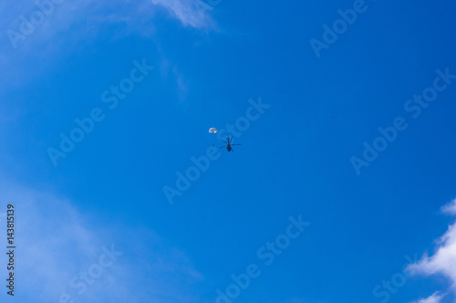 dropping parachutists from a helicopter