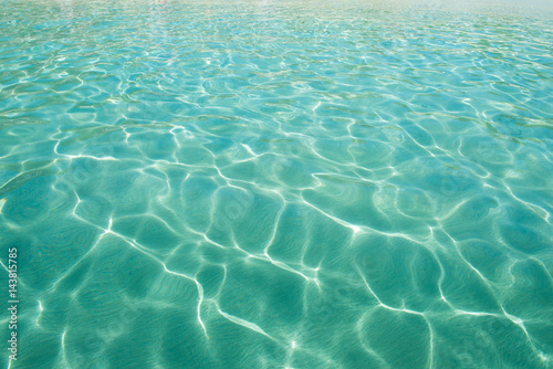 Obraz na płótnie Shining blue water ripple background. Clear sea water background. w salonie