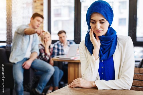 Cheerless muslim woman feeling unjustice from the society photo