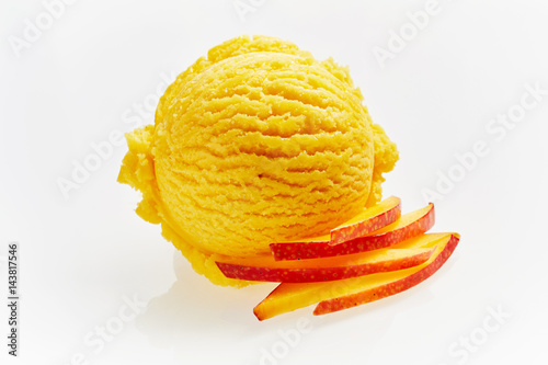 Scoop of Peach Ice Cream with Slices of Peach photo