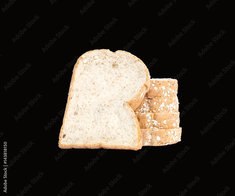 Closeup pile of wheat bread for breakfast isolated on black background with clipping path