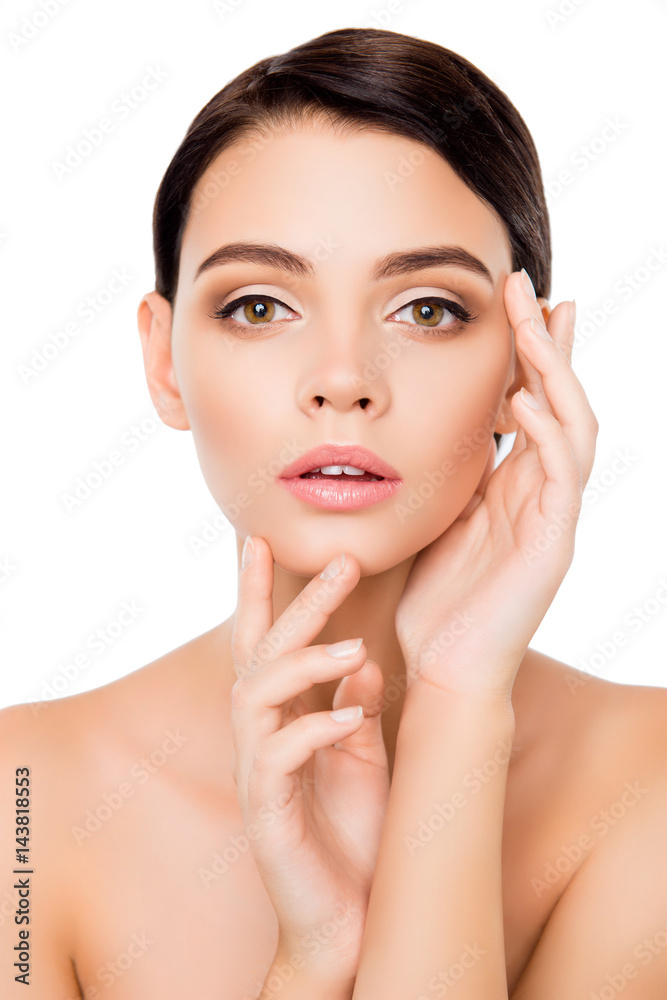 Portrait of young woman touching her face Portrait of young woman touching her face