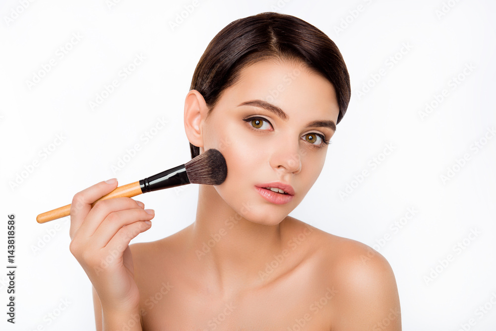 Portrait of young beautiful woman holding the makeup brush Portrait of young beautiful woman holding the makeup brush