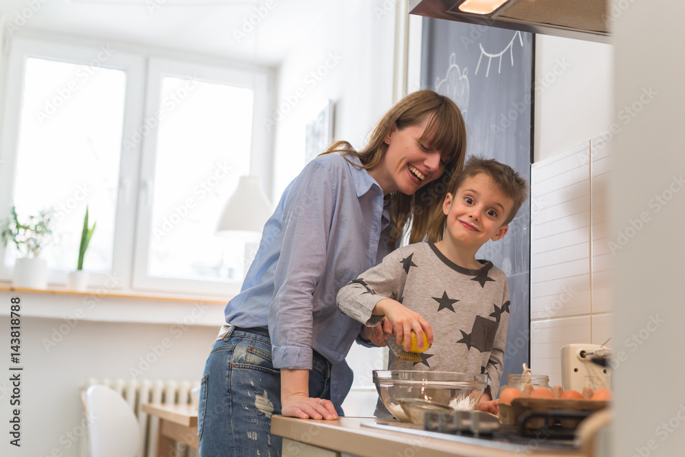 Family time in kitchen. Mother and her son cooking . Family time in kitchen. Mother and her son cooking .