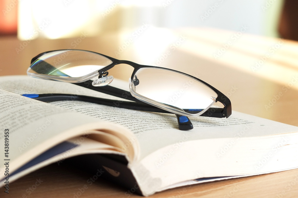 Glasses and book