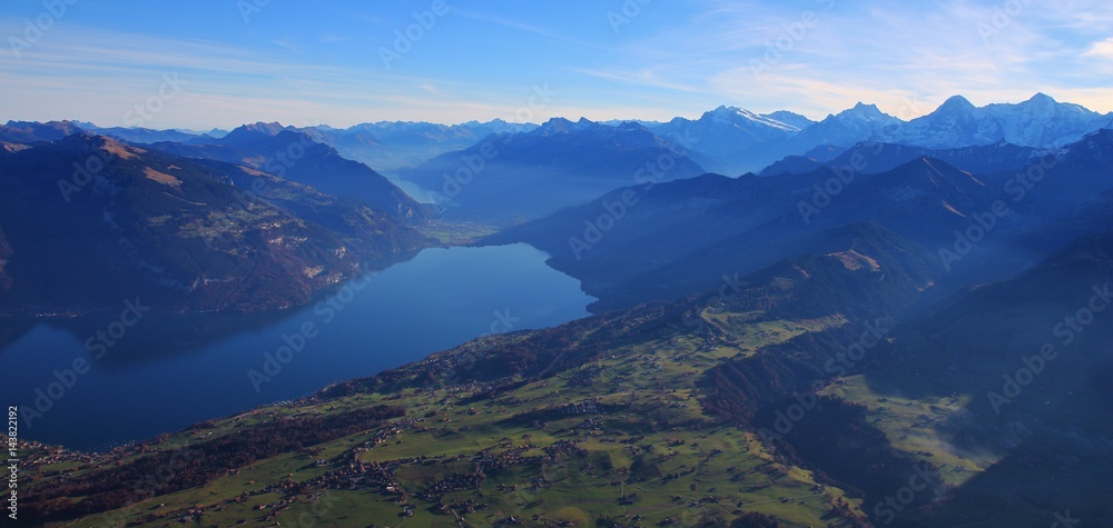 View from mount Niesen towards lake Thunersee. Villages Aeschi and Aeschiried.
