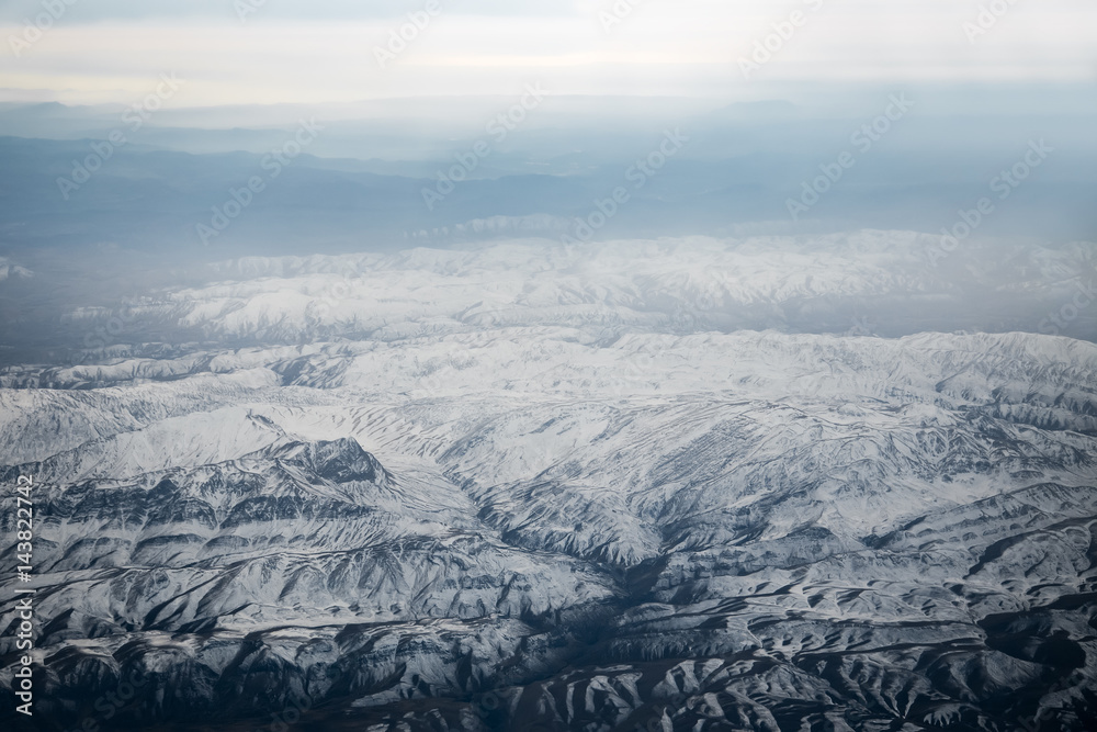 Aerial view from air plane of snow mountains