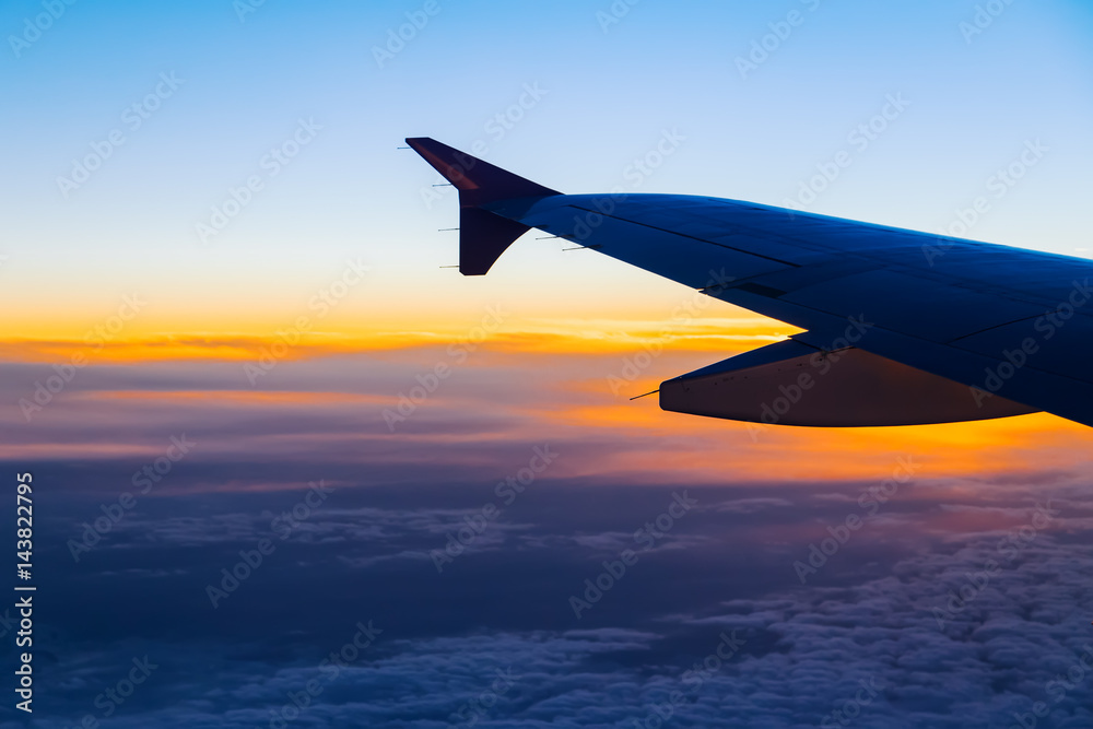 Aerial view from airplane window at sunset Aerial view from airplane window at sunset