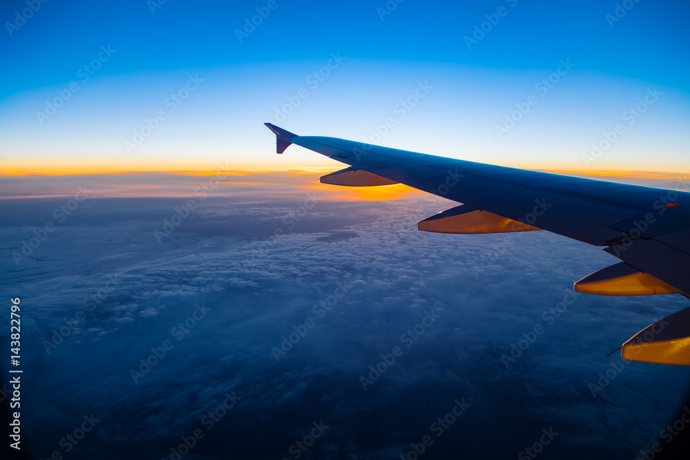 Aerial view from airplane window at sunset Aerial view from airplane window at sunset