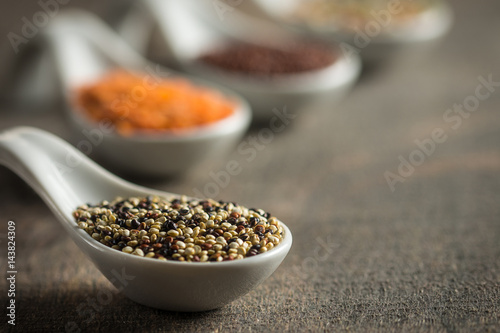 Kitchen spoons with mixed quinoa and other grains