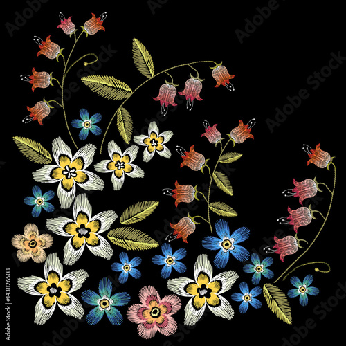 Beautiful camomiles, cornflowers, classical embroidery on black background, fashionable template for design of clothes