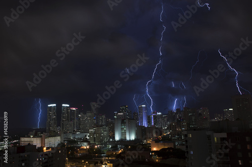 Tropical thunderstorm at night over Miami with massive lightning. Florida. USA