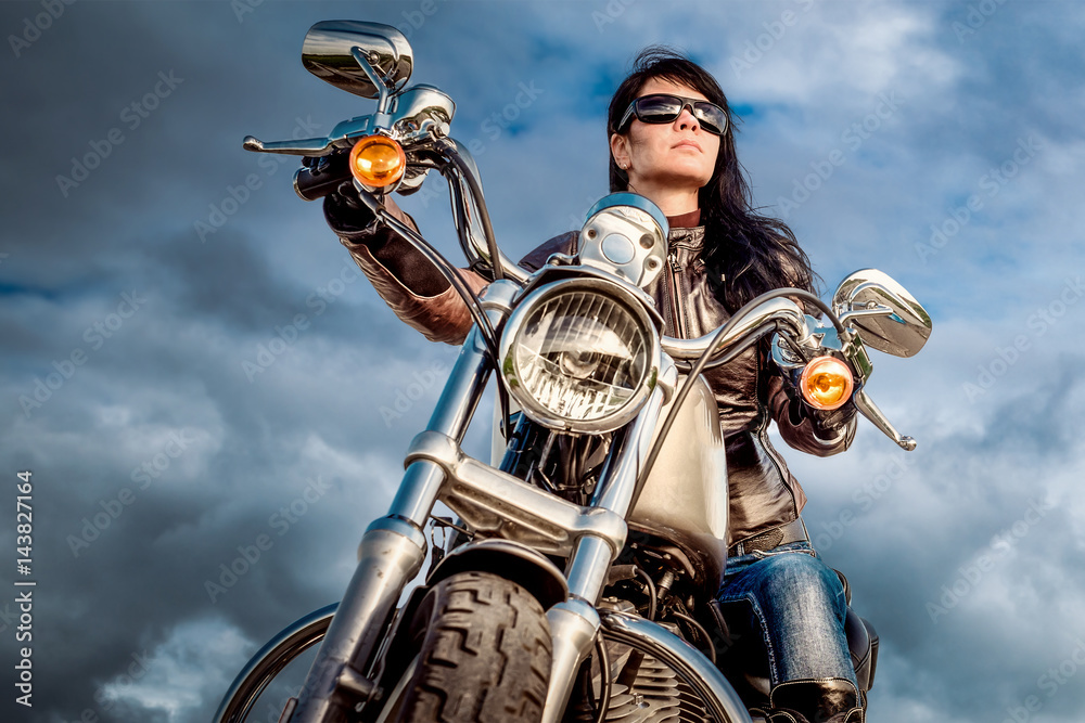 Fototapeta premium Biker girl on a motorcycle