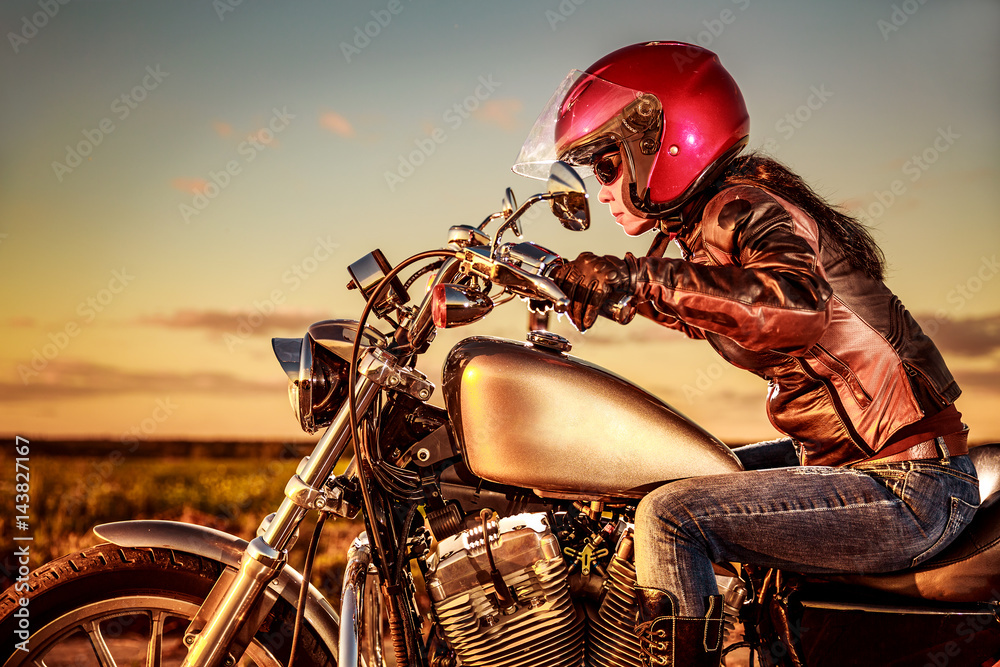 Naklejka premium Biker girl on a motorcycle