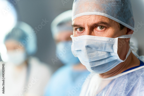 Mature medical person ready for operation