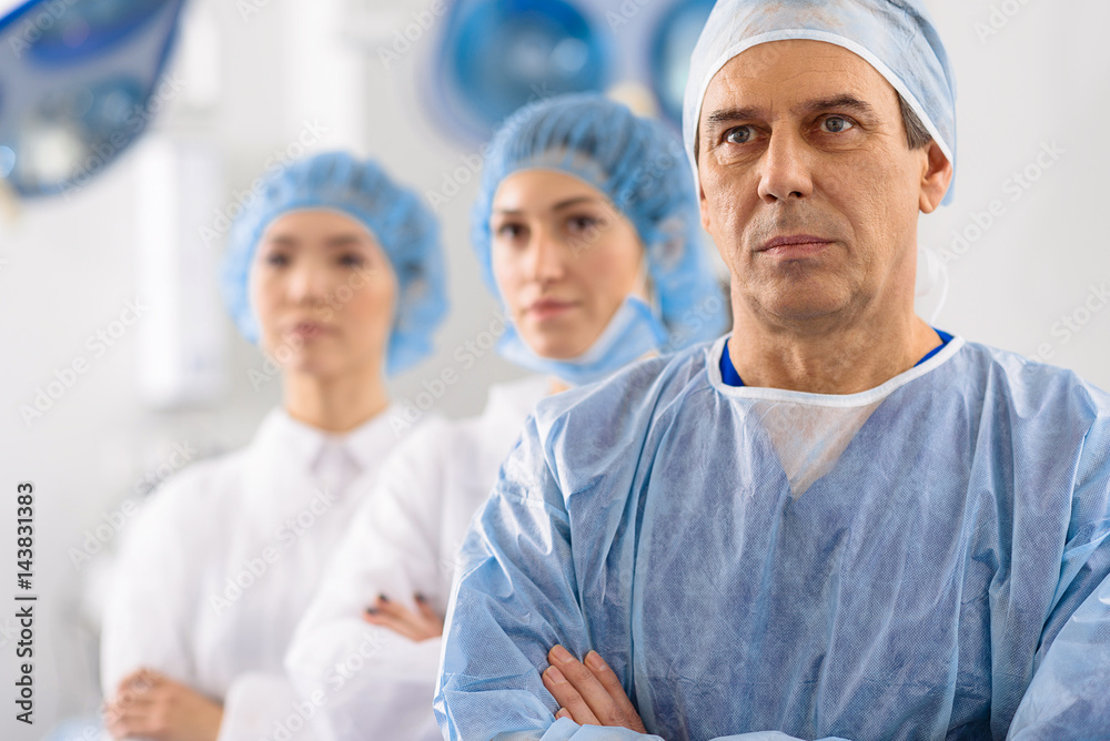 Confident doctors in operating theatre