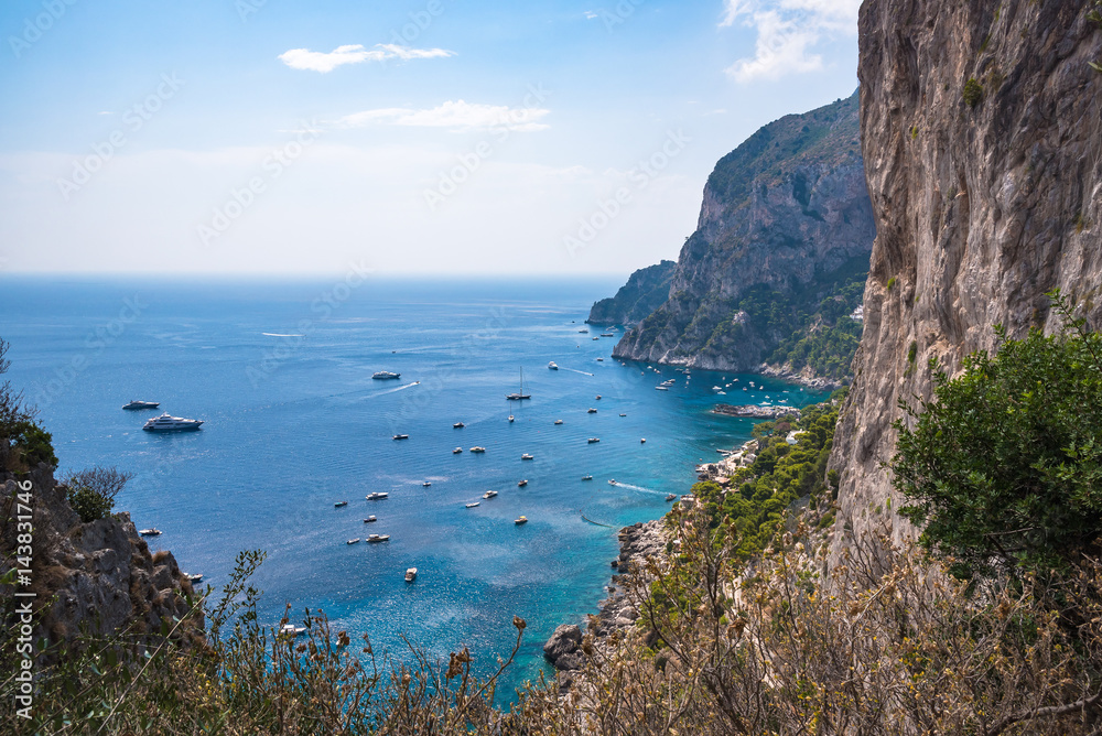 Boats at the cliff coast of Capri Island
