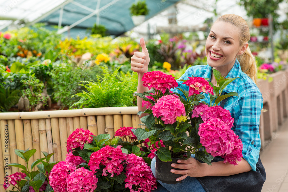 Female florist working at the greenhouse